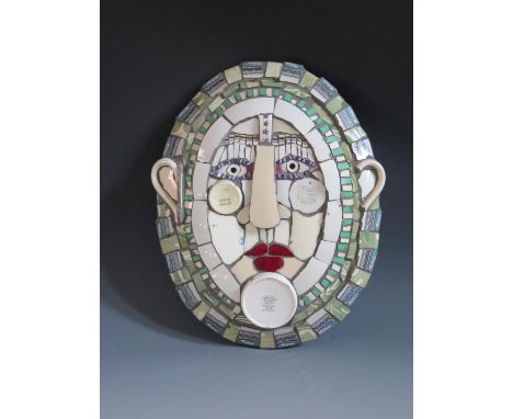 A Cleo Mussi (b.1965) Ceramic Mosaic 'Platter Face 3, the oval face made from a mosaic of domestic china, siged verso and dat