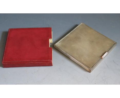 A George VI Art Deco Silver Compact with engine turned decoration and gold coloured thumb piece, London 1946, David Sutton &a