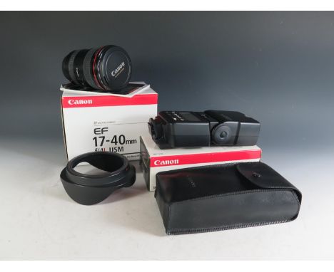 A Canon EF17-40mm f/4L USM Lense (boxed with manual) and Speedlite 540EZ. Appears in excellent condition 