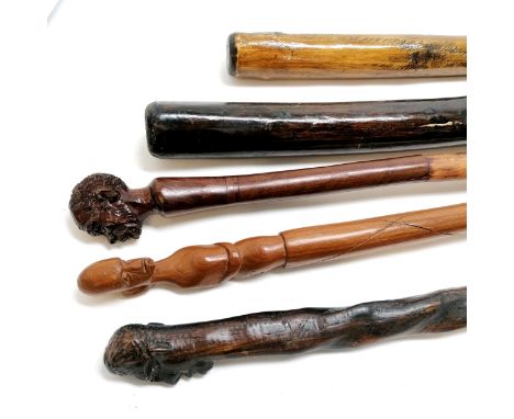 2 x vintage tribal clubs t/w 3 x walking sticks with carved head handles 