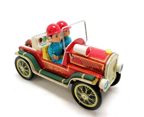 Vintage boxed Fire Chief tin plate car, battery operated and complete. Some marks to the paint otherwise in good condition. 2