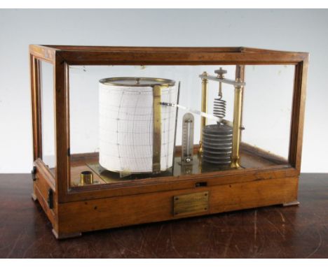 An oak case Negretti and Zambra barograph, the base with single pull out drawer for charts and graphs, with eight aneroid dis