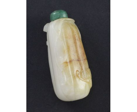 A Chinese white and russet jade 'bitter melon' snuff bottle, 1800-1900, carved in relief with a butterfly, tendrils and leave
