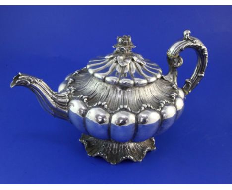 A William IV silver teapot by Edward, John & William Barnard, of compressed melon form, with rose finial, on textured wavy fo