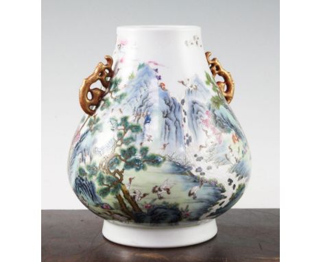 A Chinese famille verte pear shaped vase, Hu, painted with cranes in a mountainous river landscape, Qianlong seal mark, 21cm