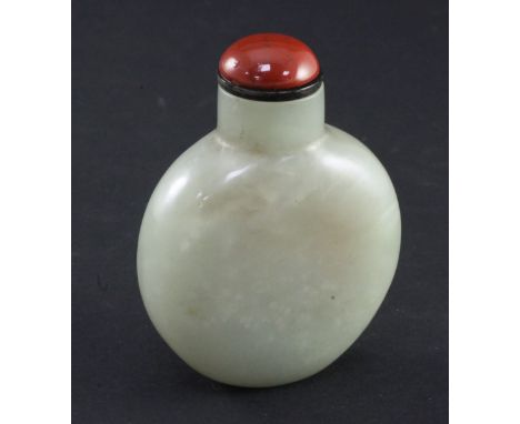 A Chinese pale celadon and russet jade snuff bottle, of flattened globular form, the stone with pale brown and white inclusio