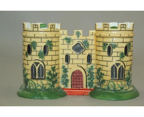 A rare Minton porcelain castle shaped inkstand, c.1830, the two castellated towers housing a sander and a lidded inkwell, the