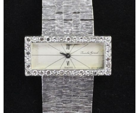 A lady's 18ct white gold and diamond Bueche Girod manual wind wrist watch, with rectangular dial and diamond set bezel, with 