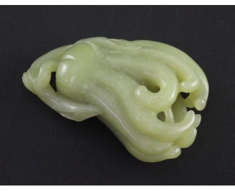 A Chinese yellow jade carving of a finger citron, the stone of greenish-yellow tone with occasional white mottling, 8cm