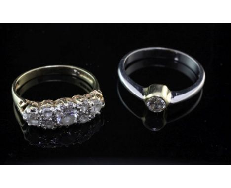 Two 14ct gold and diamond rings, seven stone half hoop and solitaire, sizes K & N.