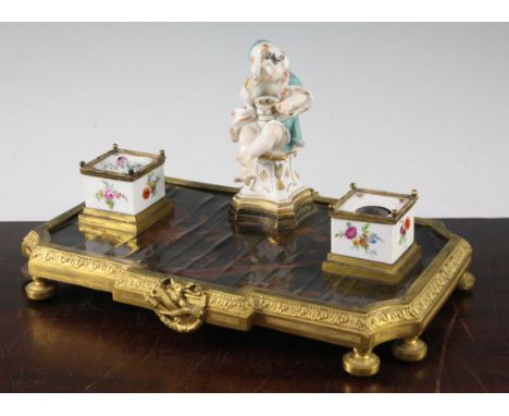 A Continental ormolu and porcelain mounted ink stand, 18th century and later, comprising a late 18th century German porcelain