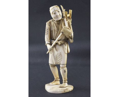 A Japanese sectional ivory figure of a woodsman, early 20th century, the figure holding an axe, a stick and a bucket, on a na