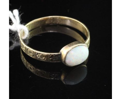 An antique gold and white opal ring, with oval stone and engraved panelled shank with interior initials, (a.f.), size S.