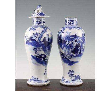 Two Chinese blue and white baluster vases and a cover, late 19th century, each painted with scholars playing weiqi in a garde