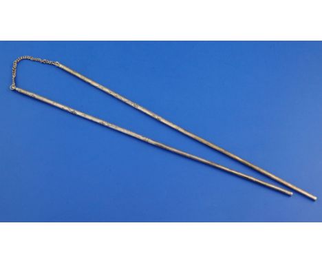 A pair of sterling silver chopsticks, with chain link and engraved decoration, 9in.