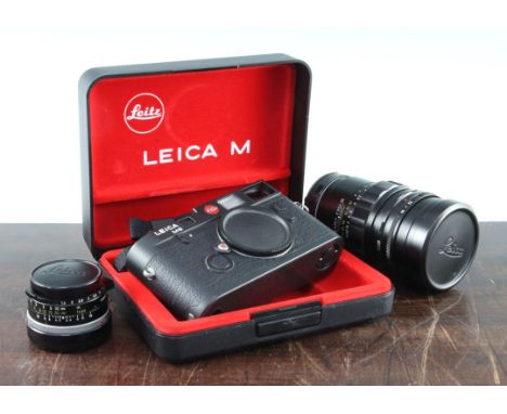 A Leica M6 black 1665516, with black plastic case and original cardboard box, together with a Leitz Summilux 35mm lens and a 