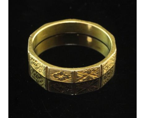 An early 19th century Scottish? 18ct gold decagonal ring, engraved with geometric motifs, stamped 18c with lion en passant on