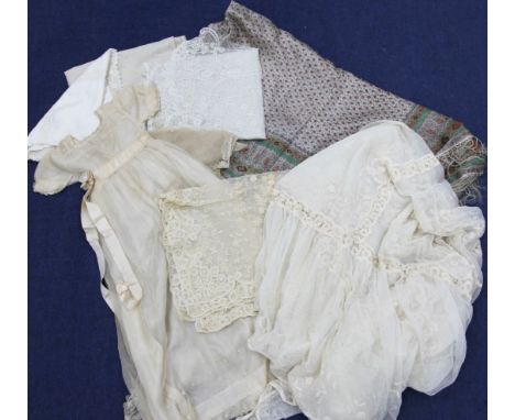 A collection of Georgian textiles, including a lace bed cover with pillow case and panel to match, baby's gown, silk paisley 