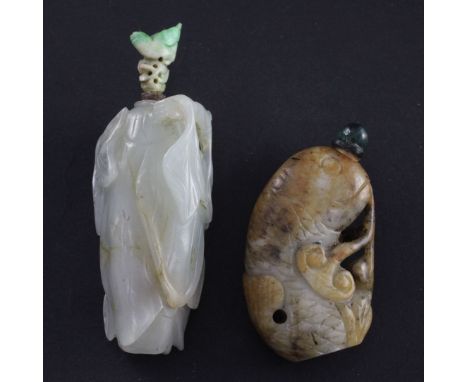 Two Chinese jade snuff bottles, 18th / 19th century, the first of pale celadon and russet jade carved as overlapping leaves a