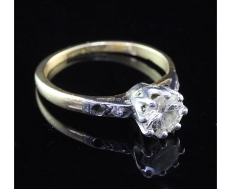 A mid 20th century 18ct gold and platinum single stone diamond ring, with diamond set shoulders, the central stone weighing a