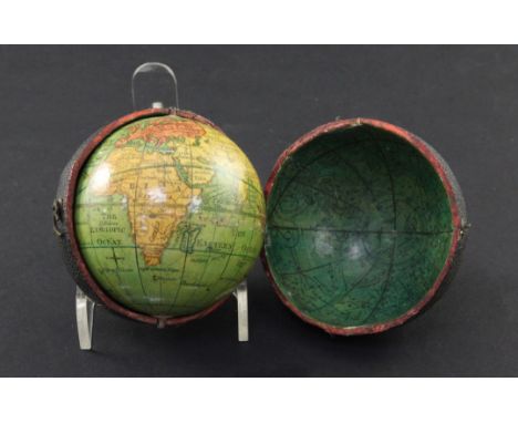 A Lane's Pocket Globe, London 1809, 2.75in. wide, the terrestrial globe within a black fishskin case with three catches lined
