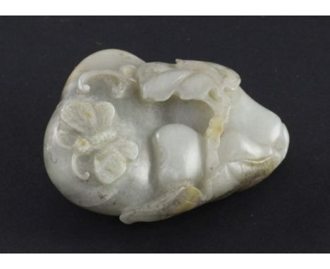 A Chinese pale celadon russet and black jade carving of gourds, carved in high relief and openwork with smaller gourds, leave