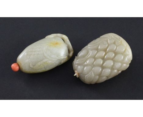 Two Chinese celadon and russet jade snuff bottles, 1800-1900, the first of pale celadon jade carved as pomegranate seeds on a