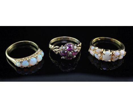 An early 20th century 18ct gold, amethyst and seed pearl cluster ring and two later rings, one stamped 18ct, all size P