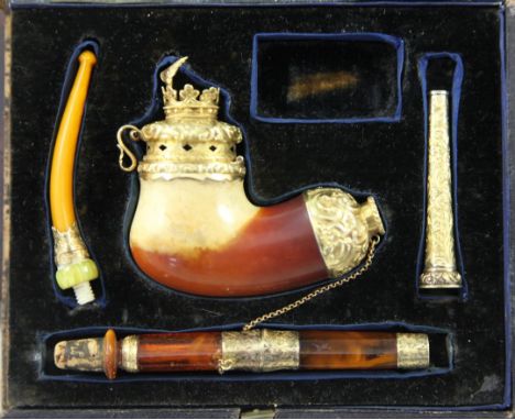 A Victorian cased Meerschaum pipe smoking set, with 18ct gold mounts marked for RD, London 1853, with amber mouthpiece and ot