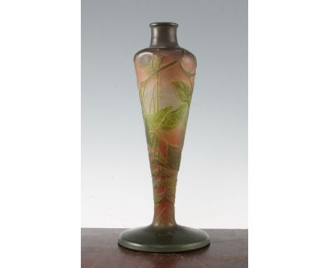 A Gallé cameo glass lamp base, c.1910, decorated with sycamore branches and leaves, predominantly in orange and green, etched