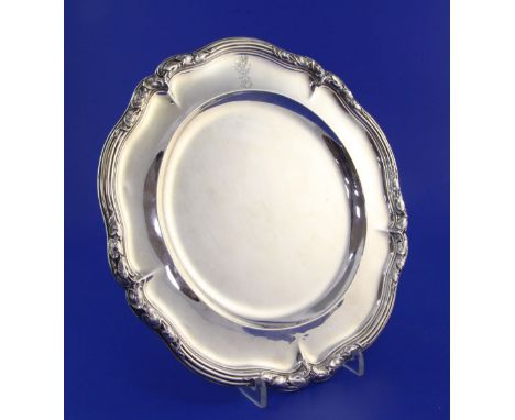 An early Victorian silver dinner plate by Paul Storr, of shaped circular form, with engraved initial with coronet and dragon 