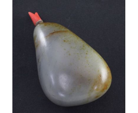 A Chinese grey and russet jade 'pebble' snuff bottle, 1800-1900, the stone with russet skin and black speckled veining, 6.2cm