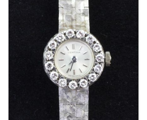 A lady's 18ct white gold and diamond set Certina manual wind wrist watch, with baton numerals and textured 18ct gold bracelet