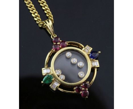 A modern 18ct gold and multi gem target pendant on a high carat curb link chain, the pendant set with baguette cut diamonds, 