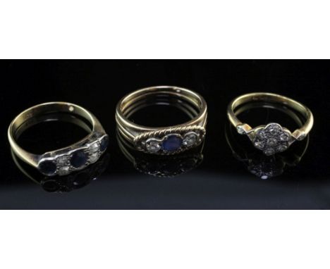 Three early to mid 20th century gold gem set rings, to include an 18ct gold diamond cluster ring and two sapphire and diamond