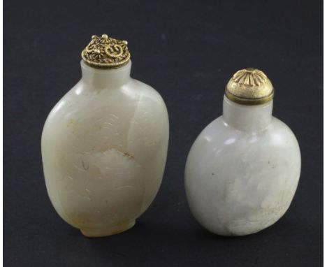Two Chinese jade snuff bottles, 1800-1900, the first of pale celadon tone incised with a stag beneath a prunus tree and a sto