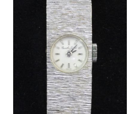 A lady's 9ct white gold Bueche Girod manual wind wrist watch, with baton numerals and bark effect 9ct gold bracelet.