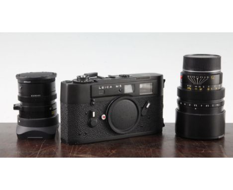 A Leica M5, black, 1290249, together with a Leitz Elmarit-M 1.2 and another Leitz Summilux-M 75mm lens