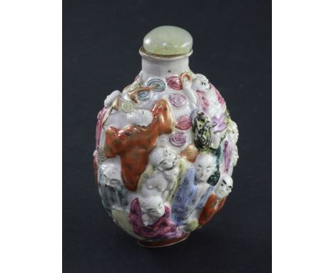 A Chinese moulded famille rose 'eighteen luohan' snuff bottle, Qianlong seal mark, 1820-1850, 7.4cm