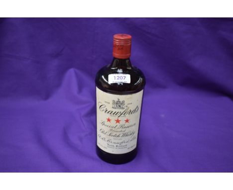 A bottle of Crawfords Special Reserve blended old scotch whisky, 26 2/3 fl.ozs, 70% proof