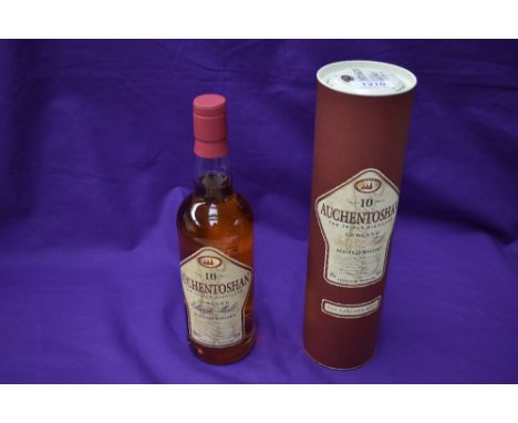 A bottle of 1980/90's Auchentoshan 10 Year Old Scotch Whisky, Triple Distilled, Lowland, 70cl, 40% vol, in card tube