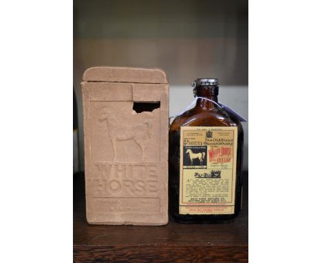 A rare old half bottle of&nbsp;White Horse whisky, bottled 23 February 1956, in original carton. 