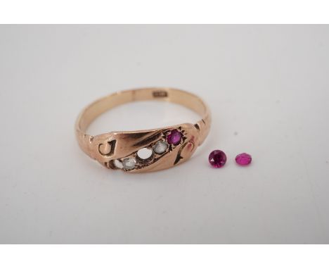 An antique ruby and white stone finger ring, the cushion-shaped face set with a diagonal band of stones between engraved scro
