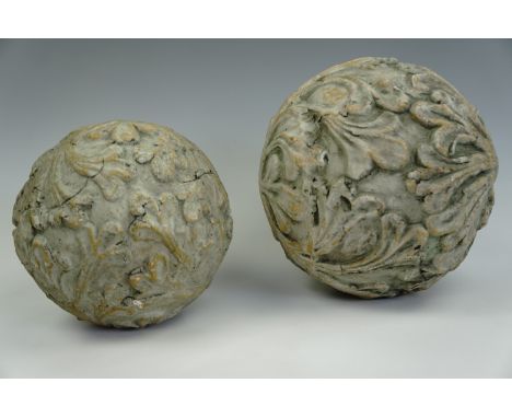 A pair of large painted terracotta relief-moulded spherical garden or domestic ornaments, largest 25 cm diameter 