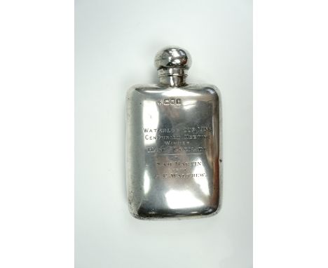 A 1920s silver hip flask bearing an engraved presentation inscription "Waterloo Cup, 1936, Centurion Meeting, winner Hand Gre