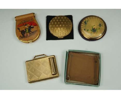 A Kigu combined powder compact and lipstick holder, together with a Stratton compact decorated with faux rose engine turning 