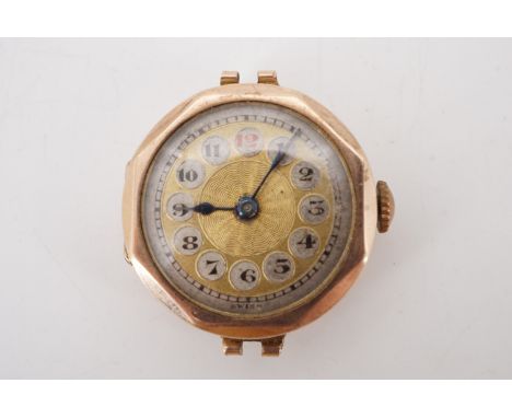 A 1920s 9 ct gold wristlet watch, having a rose engine turned face and faceted bezel, 25 mm excluding crown, (a/f), 12.5 g