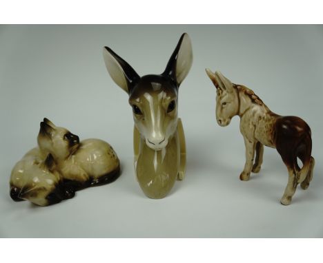 A Midwinter deer faun wall plaque, Beswick Siamese kittens and a Sylvac donkey