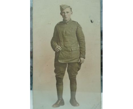 A Great War tinted photographic portrait of a Royal Flying Corps airman, in a mirrored frame, 40 cm x 25 cm