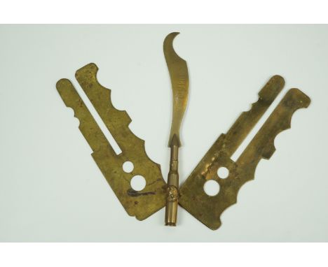 Two Great War brass button sticks and a trench art paper knife